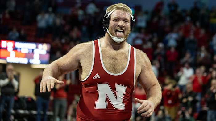 Nebraska football defensive lineman Nash Hutmacher made his collegiate wrestling debut at heavyweight and pinned his Wyoming opponent.